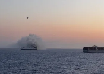 Fire-ravaged Morning Midas sinks under tow