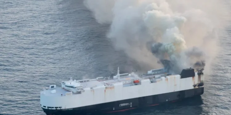 Smoke still seen rising from abandoned car carrier