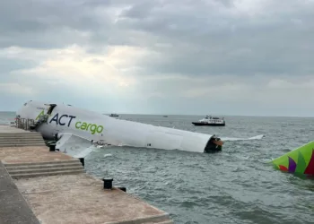 Emirates-leased cargo jet skids off Hong Kong runway, killing 2 in vehicle